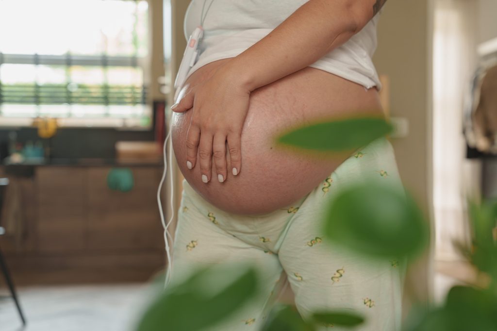 Close-up of a pregnant belly in the last hours before birth, Netherlands