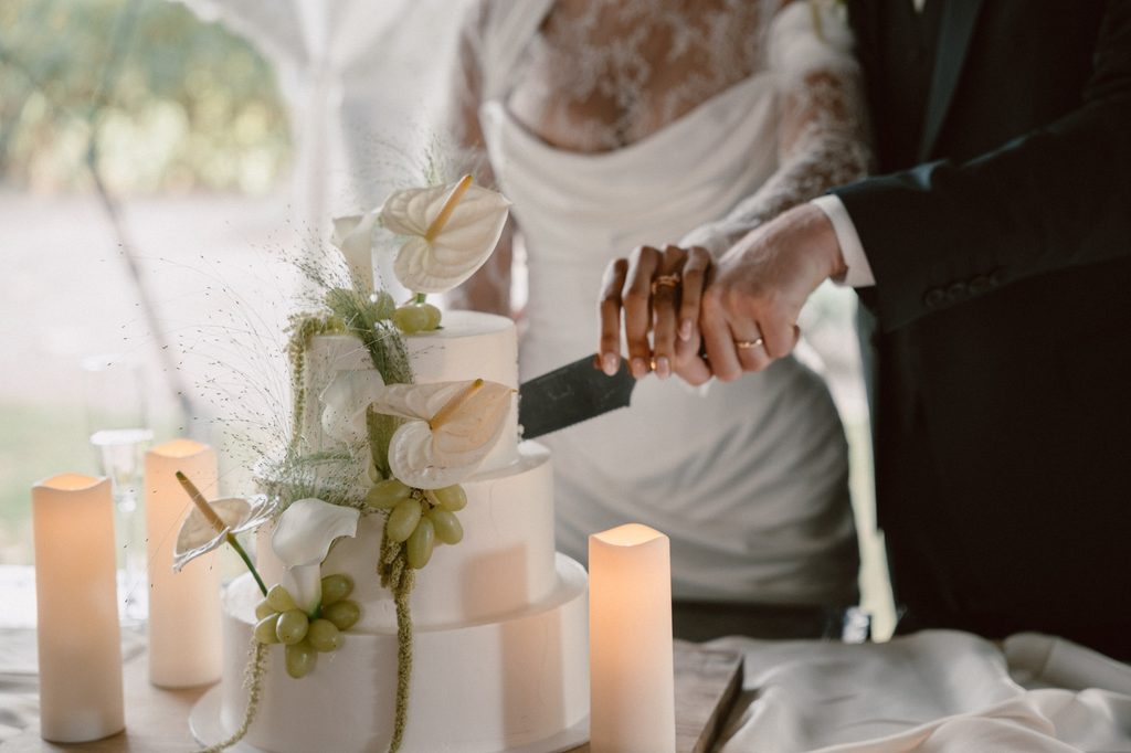 Bride putting on her wedding dress by candlelight, Mexican-Dutch wedding in the Netherlands