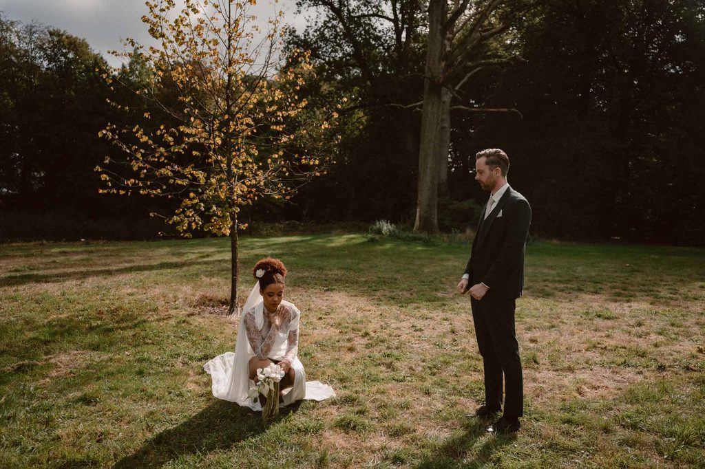 First look between bride and groom on the lawn, Mexican-Dutch wedding in the Netherlands
